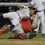 Alex Rodriguez collides at home with Jeff Mathis in the 5th inning.